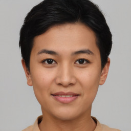 Joyful asian young-adult female with short  brown hair and brown eyes