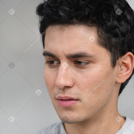 Neutral white young-adult male with short  black hair and brown eyes