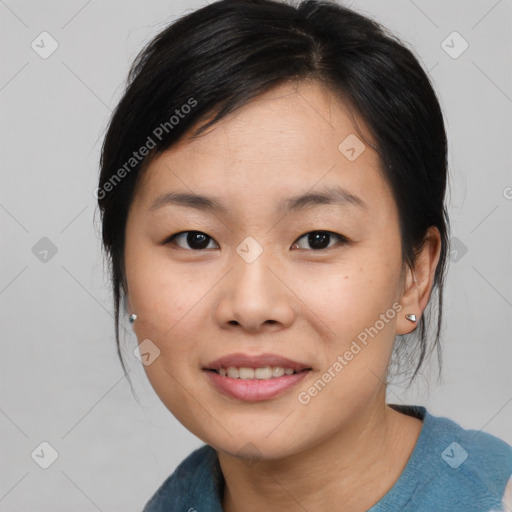 Joyful asian young-adult female with medium  black hair and brown eyes