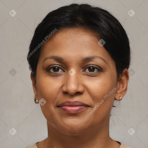 Joyful black adult female with short  brown hair and brown eyes