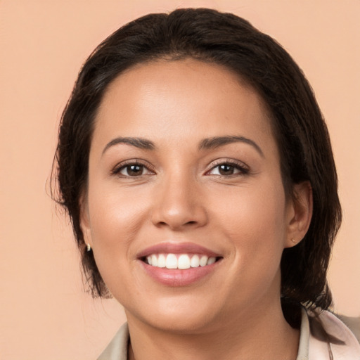 Joyful white young-adult female with medium  brown hair and brown eyes