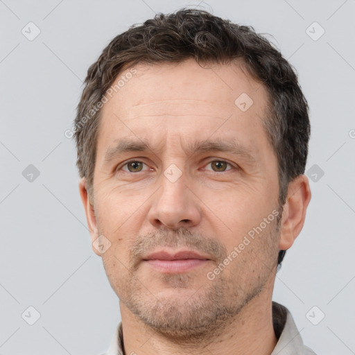 Neutral white adult male with short  brown hair and brown eyes