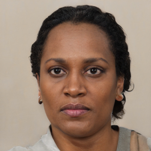 Neutral black adult female with short  black hair and brown eyes