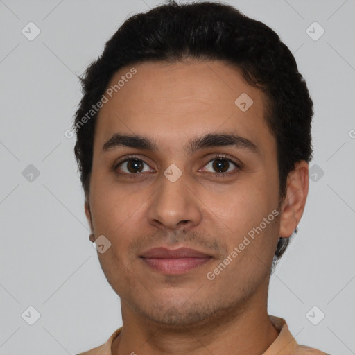 Joyful latino young-adult male with short  black hair and brown eyes