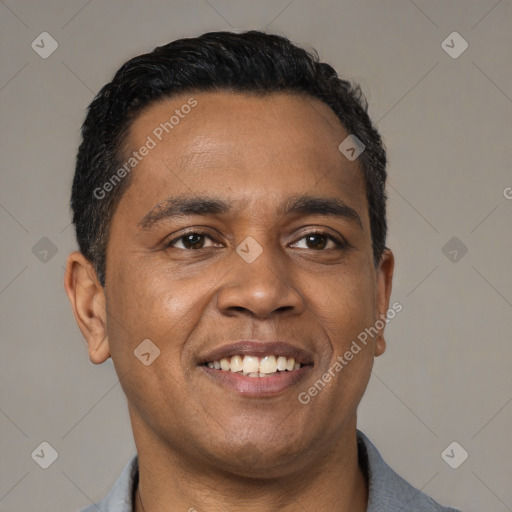 Joyful latino young-adult male with short  black hair and brown eyes