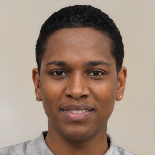 Joyful black young-adult male with short  black hair and brown eyes