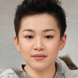 Joyful white child female with short  brown hair and brown eyes