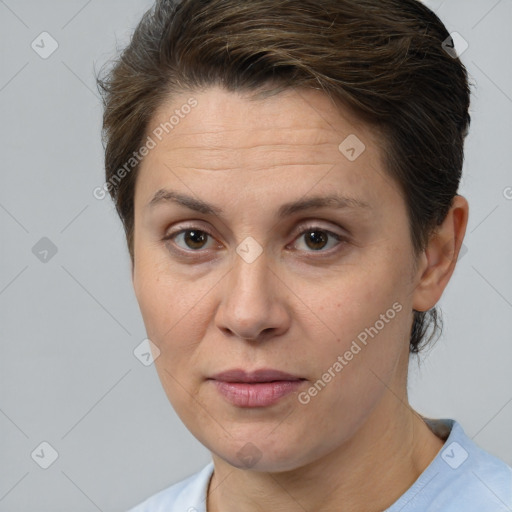 Joyful white adult female with short  brown hair and brown eyes