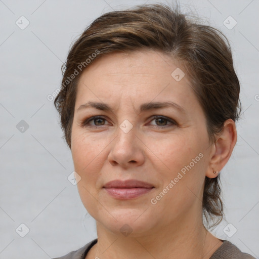 Joyful white adult female with short  brown hair and brown eyes