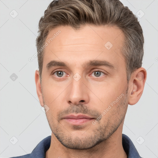 Neutral white adult male with short  brown hair and brown eyes