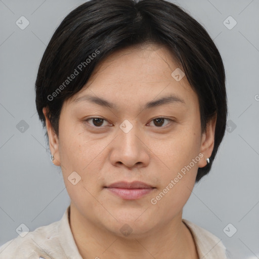 Joyful asian young-adult female with short  brown hair and brown eyes