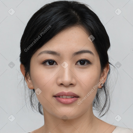 Joyful asian young-adult female with medium  black hair and brown eyes