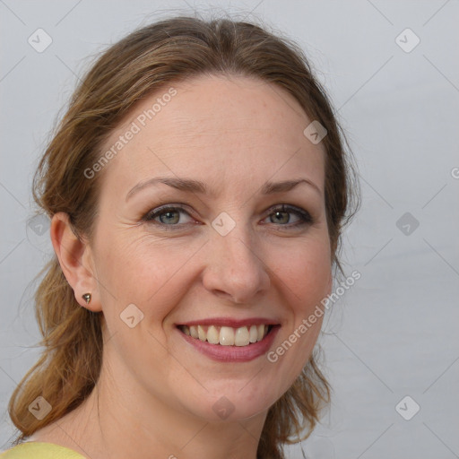 Joyful white young-adult female with medium  brown hair and grey eyes