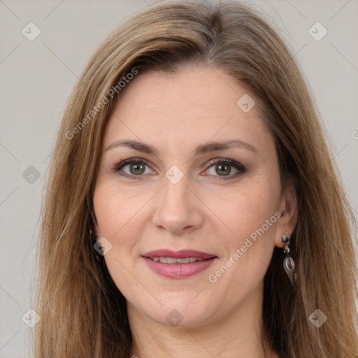 Joyful white adult female with long  brown hair and brown eyes