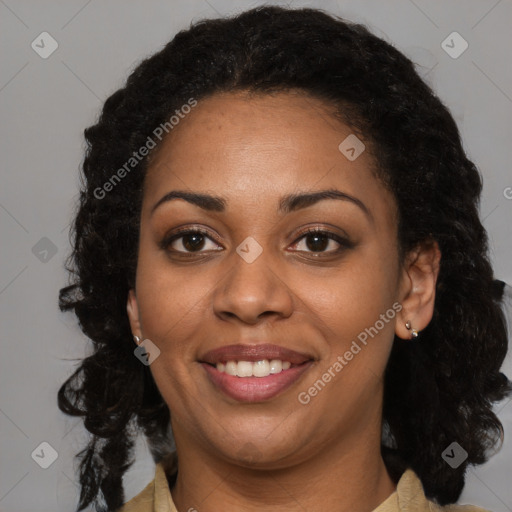 Joyful black young-adult female with long  brown hair and brown eyes