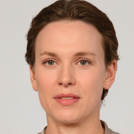 Neutral white adult female with short  brown hair and green eyes