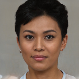 Joyful asian young-adult female with short  black hair and brown eyes