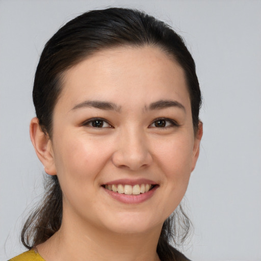 Joyful white young-adult female with medium  brown hair and brown eyes