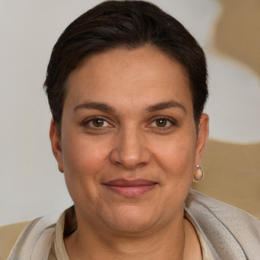 Joyful white adult female with short  brown hair and brown eyes