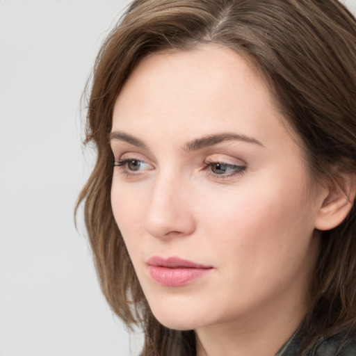 Neutral white young-adult female with long  brown hair and grey eyes