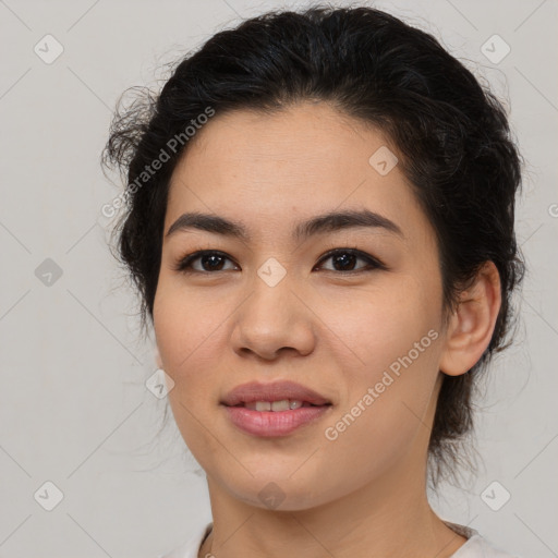 Joyful latino young-adult female with medium  brown hair and brown eyes