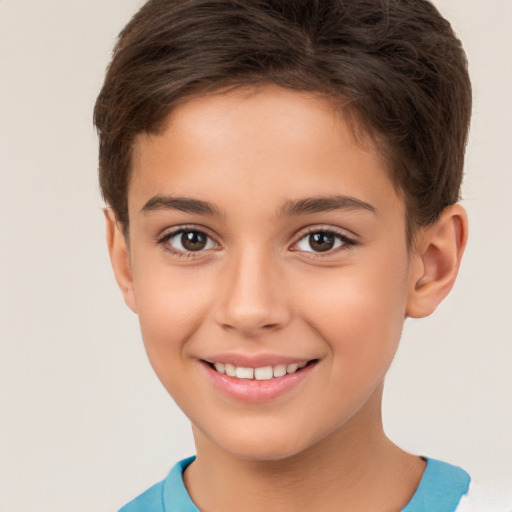 Joyful white child female with short  brown hair and brown eyes