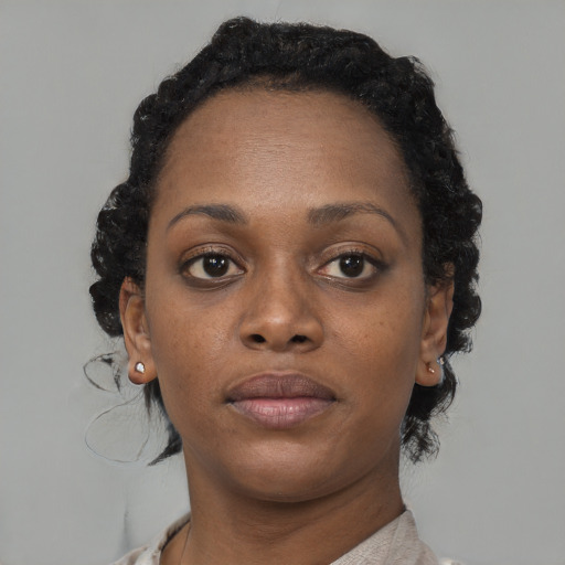 Neutral black adult female with short  brown hair and brown eyes