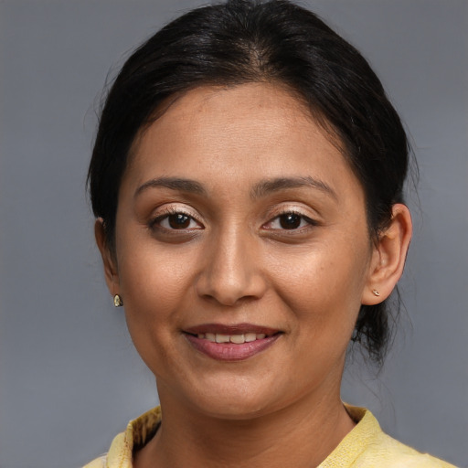 Joyful asian young-adult female with medium  brown hair and brown eyes
