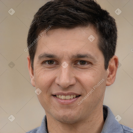 Joyful white adult male with short  brown hair and brown eyes