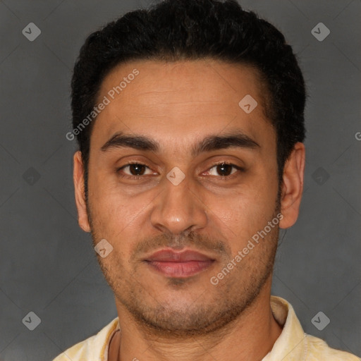 Joyful latino young-adult male with short  black hair and brown eyes