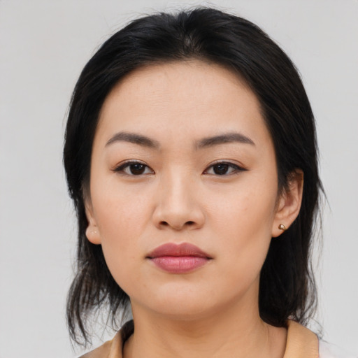 Neutral asian young-adult female with medium  brown hair and brown eyes