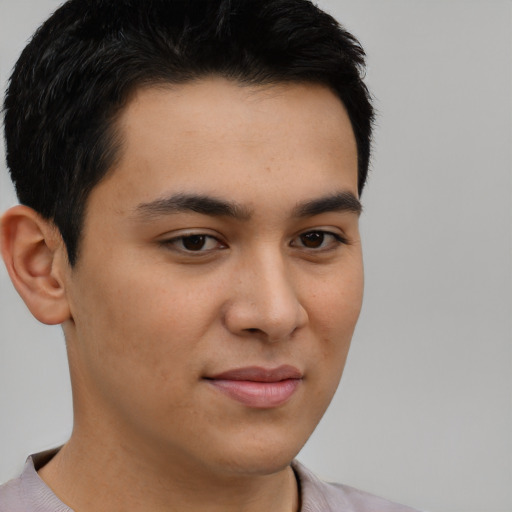 Joyful latino young-adult male with short  brown hair and brown eyes