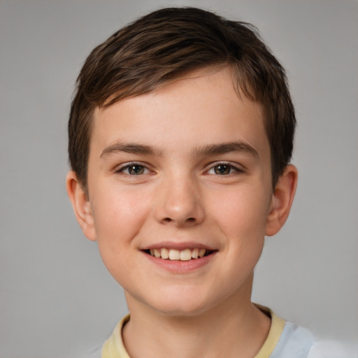 Joyful white child male with short  brown hair and brown eyes