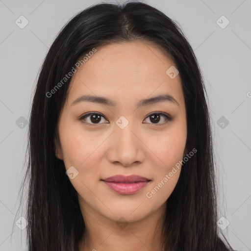 Joyful latino young-adult female with long  brown hair and brown eyes