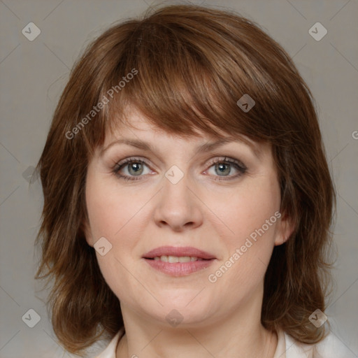 Joyful white young-adult female with medium  brown hair and green eyes