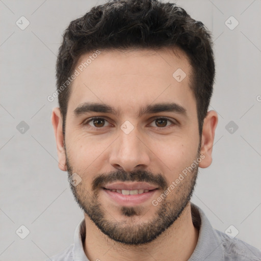 Joyful white young-adult male with short  black hair and brown eyes