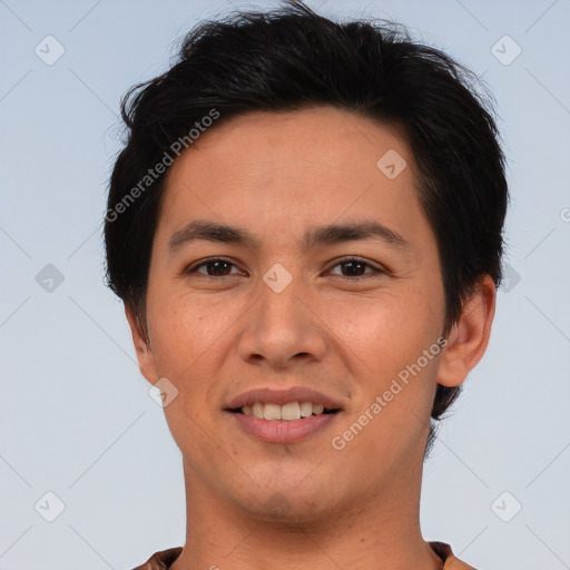 Joyful asian young-adult male with short  brown hair and brown eyes