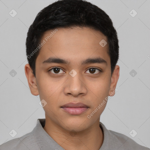 Joyful latino young-adult male with short  black hair and brown eyes