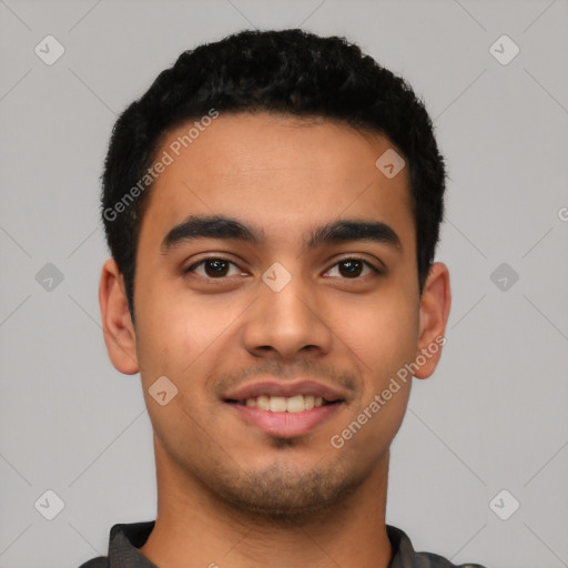 Joyful latino young-adult male with short  black hair and brown eyes