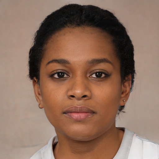 Neutral black young-adult female with short  black hair and brown eyes