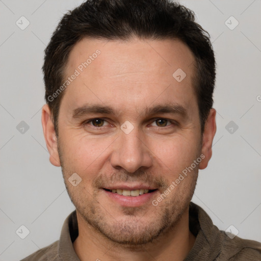 Joyful white adult male with short  brown hair and brown eyes