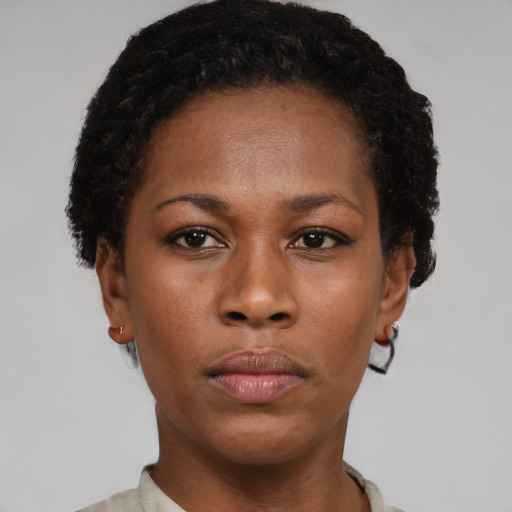 Neutral black young-adult female with short  brown hair and brown eyes
