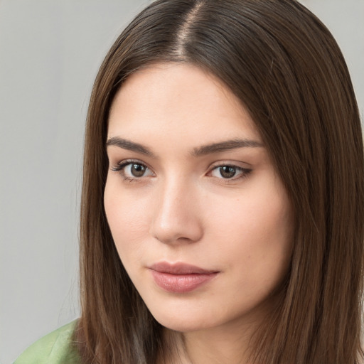 Neutral white young-adult female with long  brown hair and brown eyes