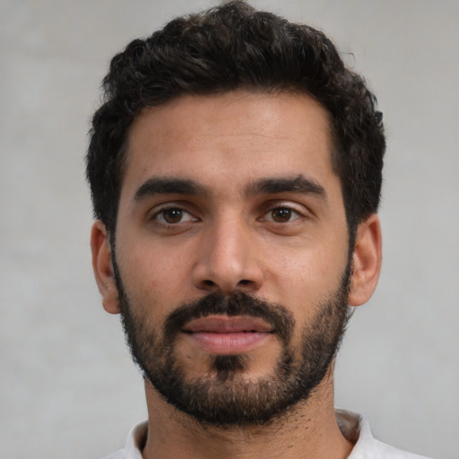 Neutral latino young-adult male with short  black hair and brown eyes