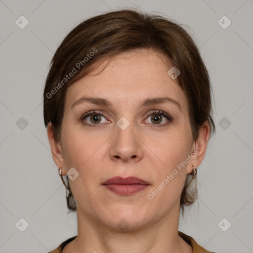 Joyful white adult female with medium  brown hair and grey eyes