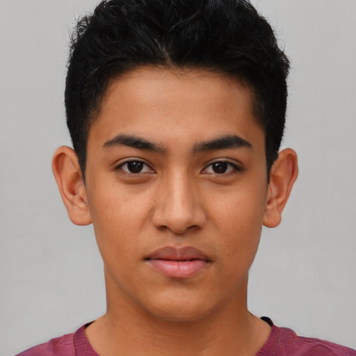 Neutral latino young-adult male with short  black hair and brown eyes