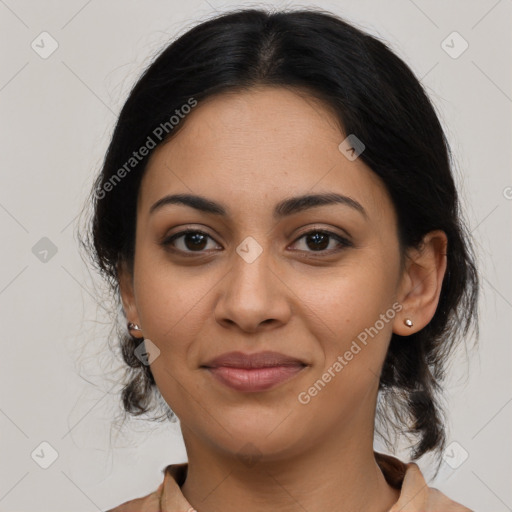 Joyful latino young-adult female with medium  brown hair and brown eyes