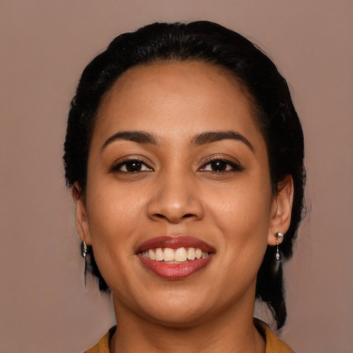 Joyful latino young-adult female with long  black hair and brown eyes