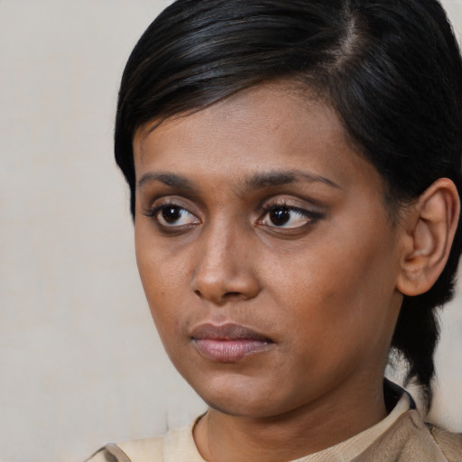 Neutral black young-adult female with medium  black hair and brown eyes