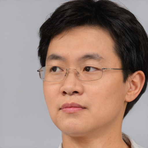 Neutral asian young-adult male with short  brown hair and brown eyes